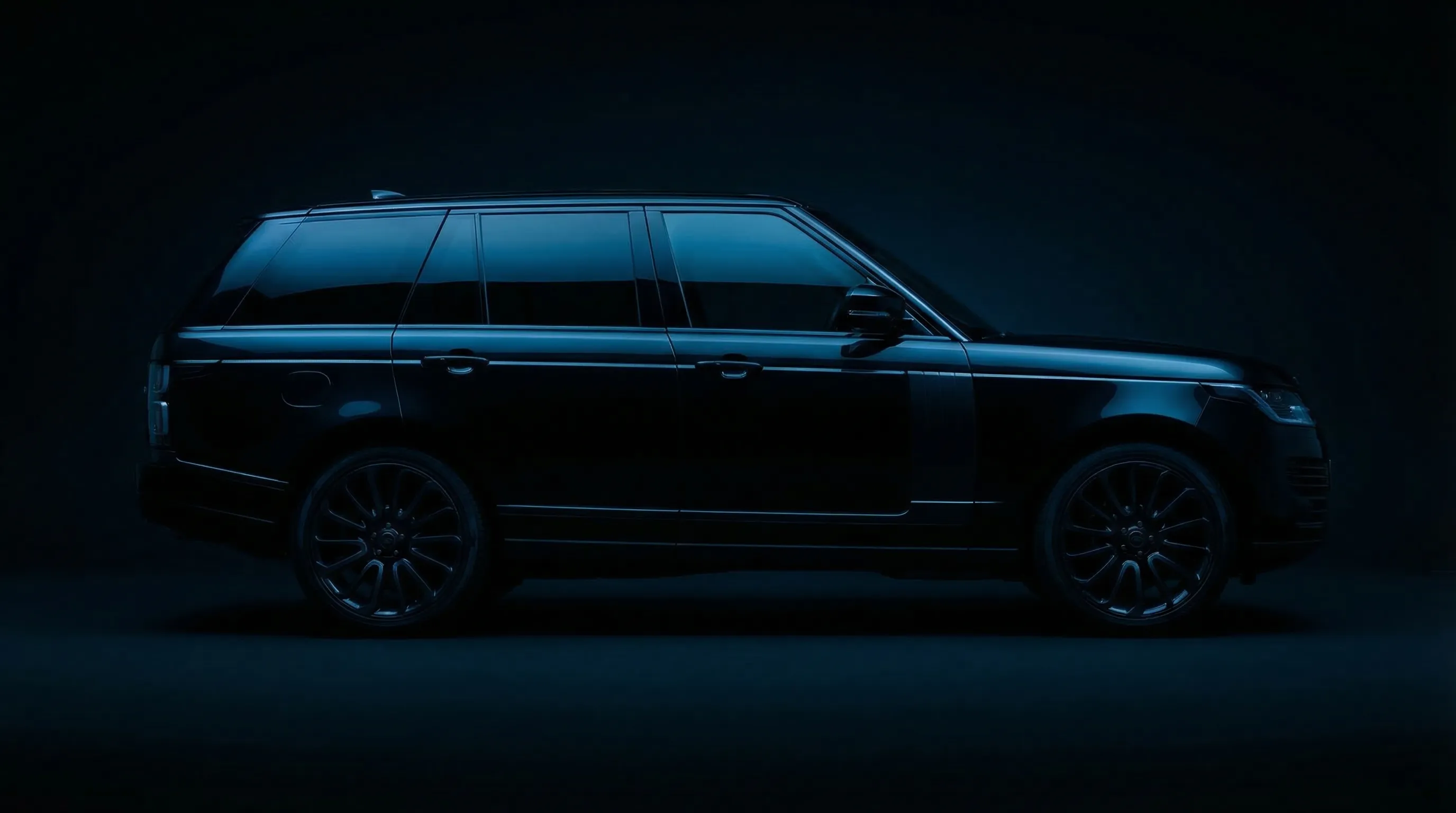 Luxury SUV with premium window tinting in professional automotive studio